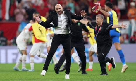 Morocco coach Walid Regragui does a little dance as his team finish top of the group.