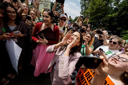 Alexandria Ocasio-Cortez (centre) speaks to abortion-rights activists outside the US Supreme Court in Washington DC after the overturning of Roe v Wade on 24 June 2022.