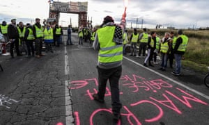 ‘Gilets jaunes’ protesters block the road leading to the Frontignan oil depot in the south of France on Monday.