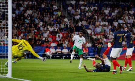Chiedozie Ogbene is denied by Mike Maignan in the France goal.