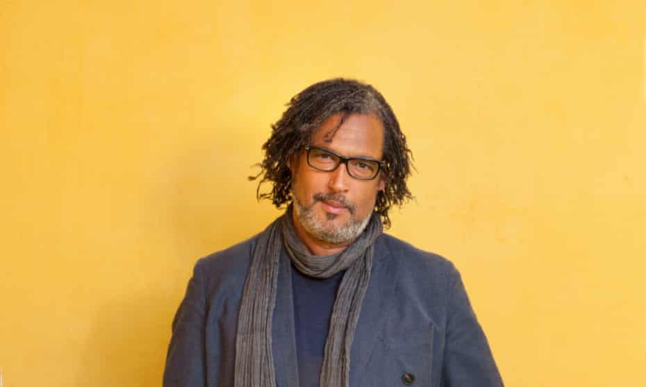 David Olusoga in front of yellow background