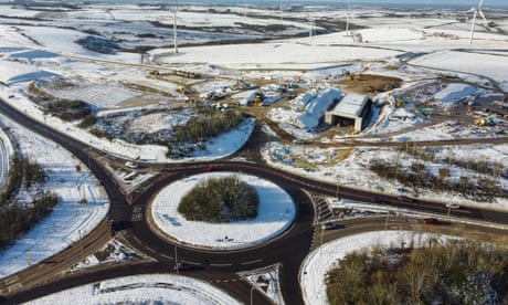 UK weather: snow and ice causes travel disruption across Britain