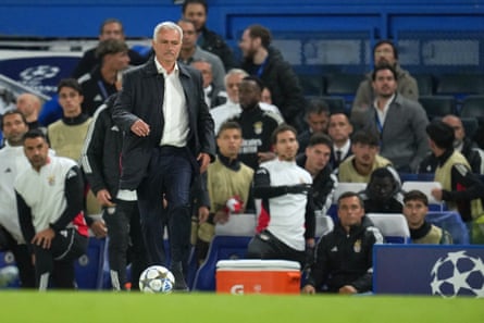 José Mourinho kicks the ball from the touchline.