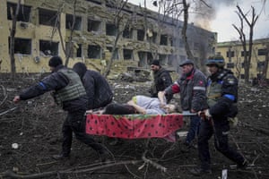 An injured pregnant woman is rescued from Mariupol’s maternity hospital after it was attacked by Russian forces