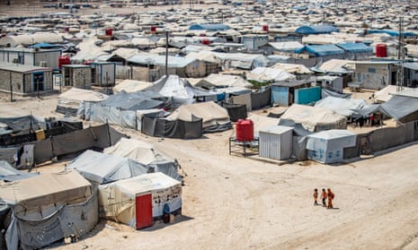 Children walking among shelters at the Kurdish-run al-Hol camp, which holds relatives of suspected Islamic State group fighters, in Syria's northeastern Hasakeh governorate