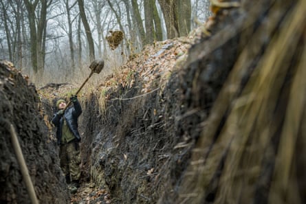 Ukrainian soldier digs trenches near Bakhmut, Donetsk, eastern Ukraine.
