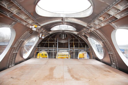 Inside view of a cylindrical room with large round windows