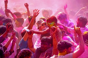 Revellers smeared with ‘gulal’ or coloured powder, celebrate Holi in Pushkar.