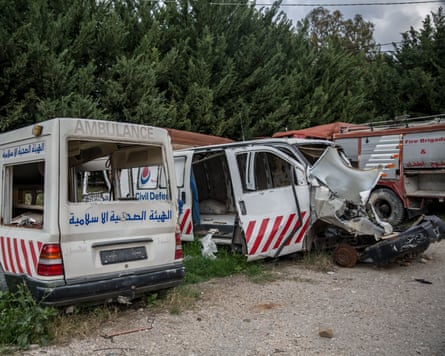 Destroyed ambulances and a fire engine lined up in a car park