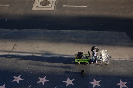 Hollywood Walk of Fame – a busker hopes to be spotted on the avenue of the stars