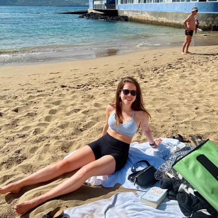 Francesca Specter sitting on a beach in Gran Canaria.