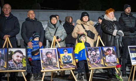 Citizens and families of Ukrainian militaries who were killed during Russia-Ukraine war, take part in a ceremony to honor the memory of fallen soldiers on the eve of the 3nd anniversary of the Russian-Ukrainian war.