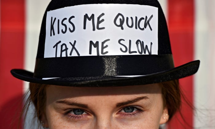 A woman participates in a protest against tax havens, at Trafalgar square in London