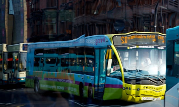 Buses are reflected in the windows of another bus at Haymarket bus station in Newcastle upon Tyne. 