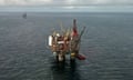 Aerial view of an oil platform in the North Sea. Platform is in the centre of the picture, surrounded by sea