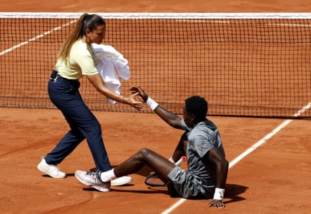 France’s Moïse Kouamé is helped to get up during his second-round match against Adolfo Daniel Vallejo