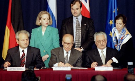 President Slobodan Milosevic of Serbia (L), President Alija Izetbegovic of Bosnia-Herzegovina (C) and President Franjo Tudjman of Croatia sign the Dayton Agreement peace accord, 21 November 1995.