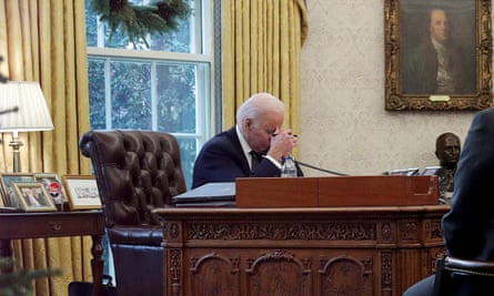 Joe Biden speaks by phone to Ukraine’s president Volodymyr Zelenskiy in the Oval Office in December last year.