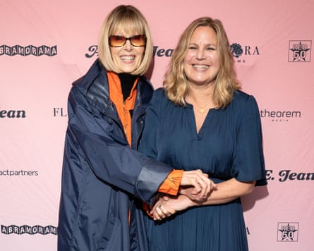 Two women smile at a press call.