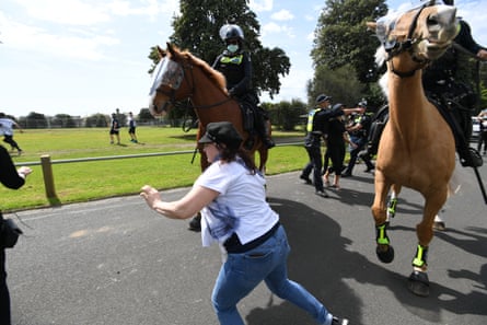 Melbourne anti-lockdown protesters arrested and chased by police on horseback | Australian police and policing | The Guardian