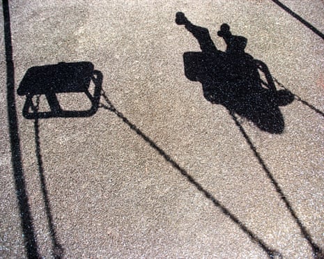 A shadow of a child on a swing