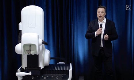 Elon Musk standing next to a surgical robot during his Neuralink presentation on 28 August 2020.