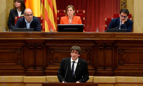 Carles Puigdemont addresses the Catalan regional parliament in Barcelona.