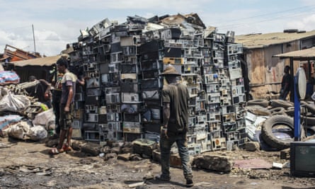 African men disassemble electronic scrap and bulky waste on the largest electronic scrap yard of Africa in Agbogbloshie, a district of Ghana's capital Accra, May 2019