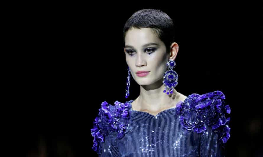 A model presents a creation by designer Giorgio Armani.