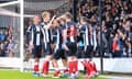 Grimsby faced the threat of relegation for months but the 2-0 win against Swindon (above) confirmed the club’s survival.
