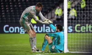 Victorious goalkeeper Conor Hazard (left) consoles Hearts’ Craig Gordon, formerly of Celtic, after the penalty shootout.