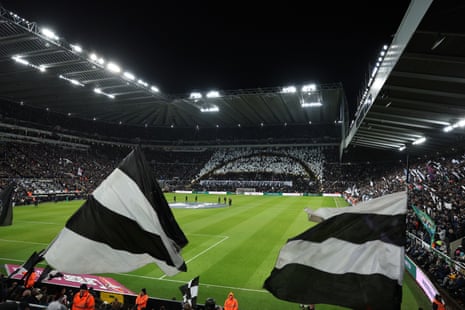 Newcastle fans display a tifo which resembles the Wembley arch, using plastic flags prior to the Carabao Cup semi-final first leg between Newcastle United and Manchester City.