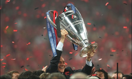 Berlusconi with the Champions League trophy, after his team, Milan, beat Liverpool in 2007.