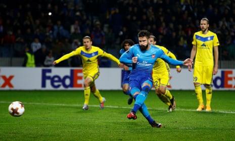 Arsenal’s Olivier Giroud scores their fourth goal from the penalty spot.