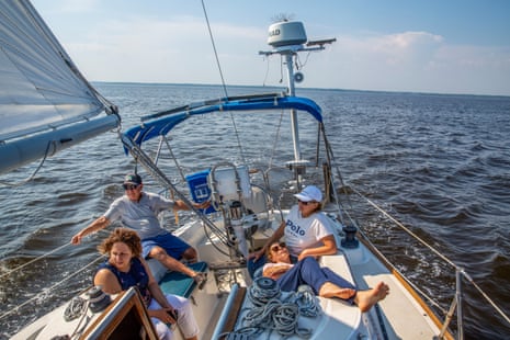 John Curry on his sailboat, Aztec, with his girlfriend Oksana Jouravska, 49, and her daughters, Zoya, 30, and Alana, 26, in New Jersey on 2 June 2023