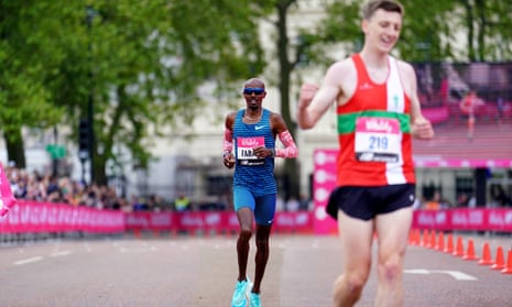 Sir Mo Farah crosses the line to finish in second place in the men's Vitality London 10,000 road race