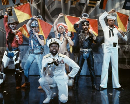 Village People wearing flamboyant costumes posing on a stage