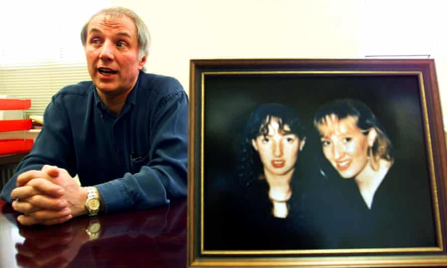 Trevor Hicks, with a photograph of his daughters Vicki and Sarah.