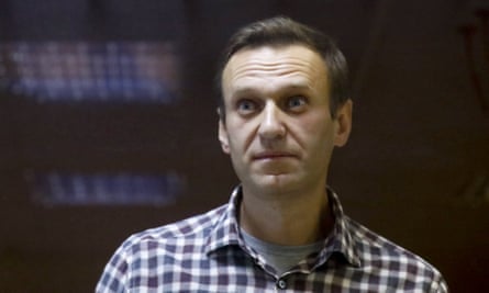 The Russian opposition leader Alexei Navalny stands in a cage in a court in Moscow in February 2021.