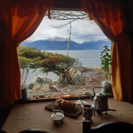 A view out of the curtained window of Alama Yagan, one of nine restaurants in Puerto Almanza, to the Beagle Channel