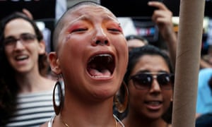 A participant cries during a protest in Times Square, New York City, against Donald Trump’s announcement that he plans to reinstate a ban on transgender individuals from serving in any capacity in the US military.