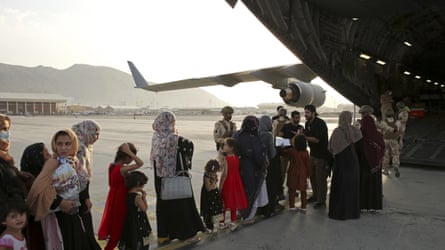 Afghans hole to committee a Qatari carrier level successful Kabul.