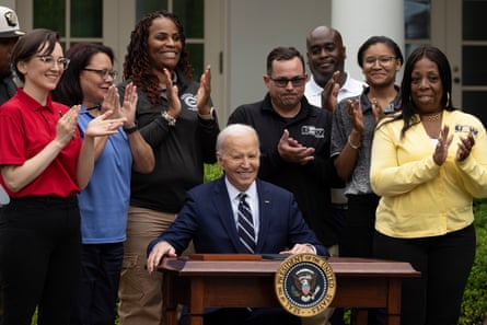 President Joe Biden signs the document ordering the raising of tariffs on some imports from China.