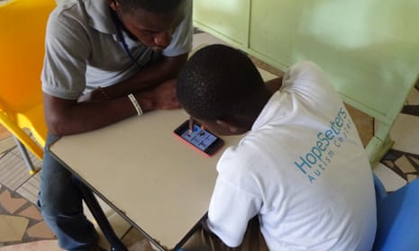 A student uses a new app designed to help autistic children learn at HopeSetters autism centre in Tema, Ghana