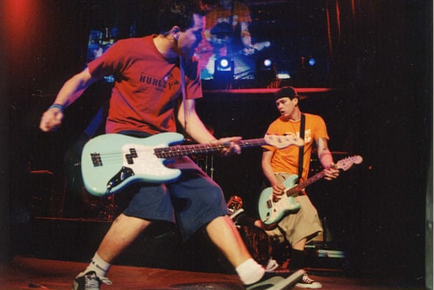 ‘On tour, I’d be reading these books full of government documents’ … Tom DeLonge with Mark Hoppus in Blink-182.