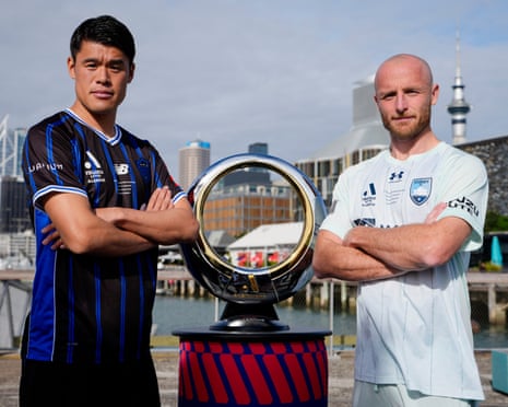 Auckland FC captain Hiroki Sakai and Sydney FC skipper Rhyan Grant with the A-League Men championship trophy before the grand final