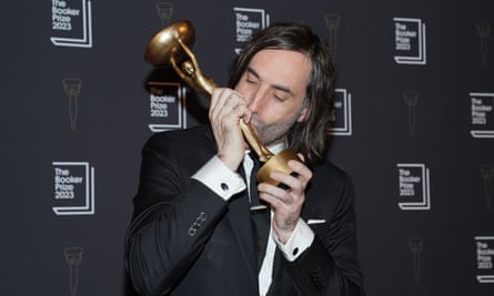 Paul Lynch kissing his Booker prize trophy
