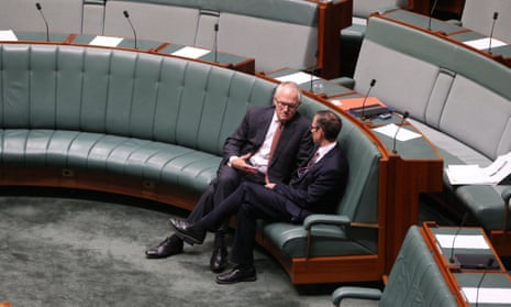 Communication minister Malcolm Turnbull talks to the shadow assistant treasurer Andrew Leigh after question time.