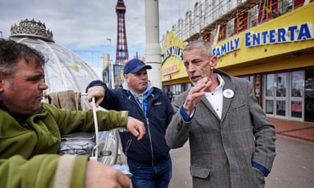 Reform UK candidate Mark Butcher speaking to landau operators on the promenade
