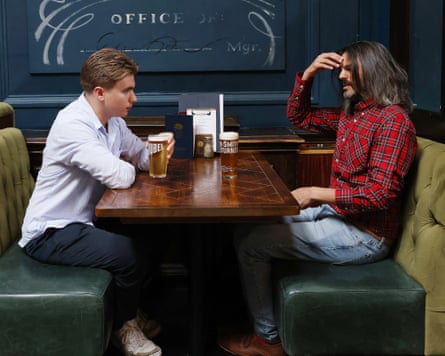 Hugo and William chat across a restaurant table